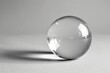 A transparent glass sphere with a clear reflection on a white backdrop, A single object against a plain background
