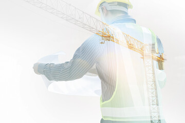 Wall Mural - Double exposure image of professional engineer in protective helmet and blueprints paper at building construction site