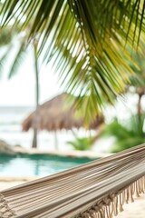 Poster - A relaxing scene of a hammock hanging from a palm tree next to a swimming pool. Perfect for creating a tropical ambiance or showcasing a vacation destination