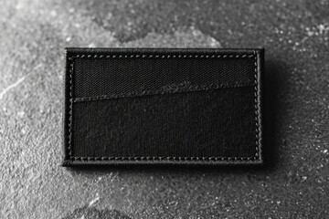 Aufkleber - A black wallet placed on a table. Suitable for financial, business, or everyday life concepts