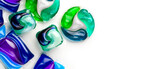 Fototapeta Przestrzenne - Washing capsules, colorful laundry pods border design. Colorful Soluble capsules with laundry gel detergent and dishwasher soap. Pile of washing pod capsules isolated. Detergent tablets. Top View