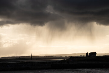 Wall Mural - Stunning dramatic landscape image of Lindisfarne, Holy Island in Northumberland England during Winter