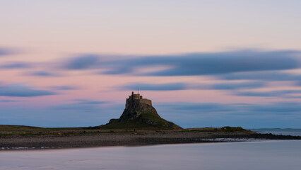 Wall Mural - Stunning dramatic landscape image of Lindisfarne, Holy Island in Northumberland England during Winter