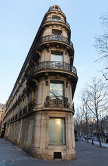 Wall Mural - The facade of traditional French house with typical balconies and windows. Paris.