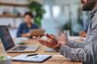 © Iwona - Meeting in an office, close-up on a man's hands making gestures while explaining.