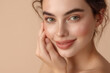 © Road Red Runner - Advertising portrait of a very beautiful model, with perfect skin, on an orange background, for skin care.