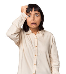 Wall Mural - Young Hispanic woman with short black hair in studio being shocked, she has remembered important meeting.