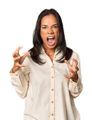 Wall Mural - Young Filipina with long black hair in studio screaming with rage.