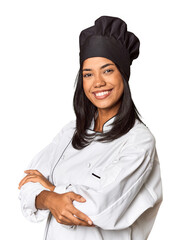 Wall Mural - Young Filipina chef posed professionally in studio