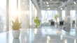 Beautiful blurred background of a light modern office interior with panoramic windows and beautiful lighting 

