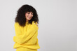 © New Africa - Happy young woman in stylish yellow sweater on white background, space for text