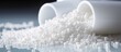 Raw materials for water pipe production: white polymer granules derived from petrochemicals and plant-based polyethylene resin, designed for easy handling.