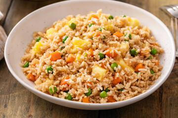 Wall Mural - Pineapple fried rice with eggs, carrots and peas