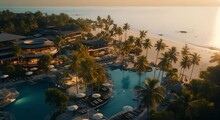 Aerial View Of Luxury Hotels And Resorts On Tropical Sea Beach At Sunset