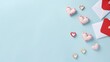 Charming Flat Lay Mock Up with Lovely Cupid Pins, Red and White Hearts Envelope on Pastel Blue Table Backdrop - Perfect for Valentine's Day and Romantic Celebrations. Creative Concept for Trendy