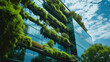 © Keitma - Architecture image with a modern glass building with a lot of green plants trees and bushes for business architecture environmental friendly and eco-concept