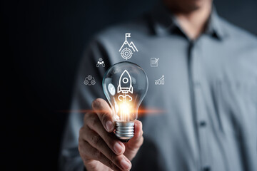 Aufkleber - Rocket launch idea inside lightbulb. strategically planning and initiating a corporate startup. aim to achieve objectives through value development, fostering leadership.