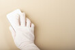 Organic cleaning supply, sponge in use, beige glove, professional sanitation