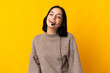 Young telemarketer woman isolated on yellow background laughing