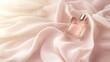 A bottle of perfume on a silk fabric background.