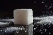 Macro shot of a single sugar cube on a black background.