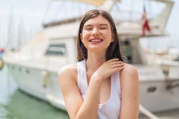 Wall Mural - Young pretty woman at outdoors With happy expression