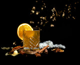 Fototapeta Tulipany - Winter cocktail with honey and orange on a black background