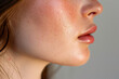 © mila103 - close-up of a woman chin with a small mole