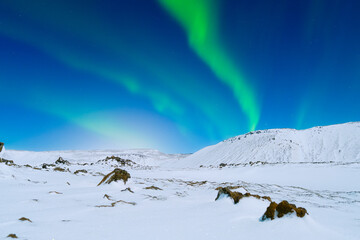 Canvas Print - Aurora Borealis. Northern Lights over the mountains. Scandinavia. Winter night landscape with bright lights in the sky. Landscape in the north in winter time.