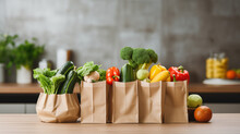 Paper Bags Full Of Healthy Food On The Kitchen Table