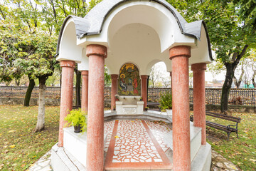 Serene Open-Air Pavilion with Religious Icon and Decorative Floor Pattern, Peaceful Prayer Site