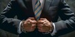 Businessman arrested for corruption. Close-up of the hands of a man in a business suit with a tie and handcuffs.