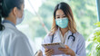 Portrait of Asian woman doctor wear protection face mask showing a patient some information on digital tablet clip board, patient listen to specialist doctor in clinic office, medical protect banner