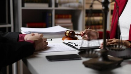 Wall Mural - Businessman, legal advisor and lawyer discussing the terms of a contract paperwork before signing the agreement document.