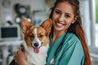 A compassionate female veterinarian in a white lab coat tenderly holds a cute dog during a check-up..
