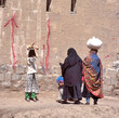 Women with veils talking to each other on a street in Sana'a the capital of Yemen