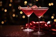 two red cosmopolitan Valentines day cocktails in martini glasses with bokeh copy space left