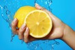Hand holding lemon to squeeze