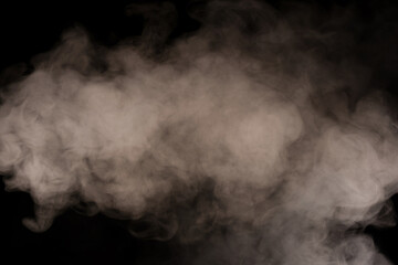 Wall Mural - White steam on a black background.