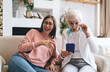 © BullRun - Shocked aged multiracial girlfriends reacting on information on smartphone