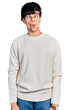 © Krakenimages.com - Handsome hipster young man wearing casual winter sweater making fish face with lips, crazy and comical gesture. funny expression.