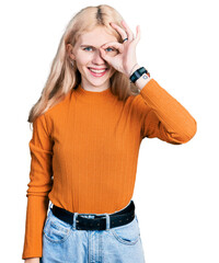 Poster - Young caucasian woman wearing casual clothes doing ok gesture with hand smiling, eye looking through fingers with happy face.