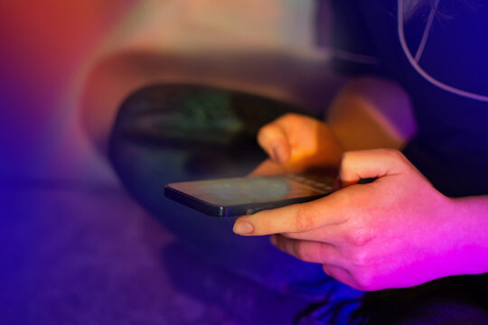 Woman using smartphone. Communicating distantly in social networks. Woman using mobile phone app.