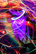 Portrait of stylish model girl  enjoying music party in iridescent neon background. Girl dancing and enjoying party.