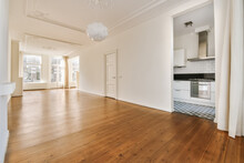 Spacious Empty Living Room With Kitchen Entrance
