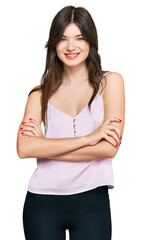 Sticker - Young beautiful caucasian girl wearing casual clothes happy face smiling with crossed arms looking at the camera. positive person.