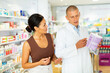 © JackF - Pharmacist advises customer in a pharmacy, offers medicine for body care