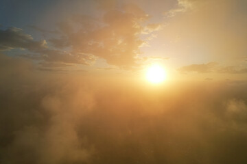 Wall Mural - sun glow through foggy clouds