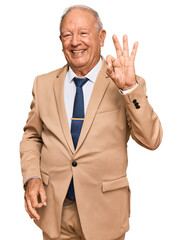 Wall Mural - Senior caucasian man wearing business suit and tie smiling positive doing ok sign with hand and fingers. successful expression.