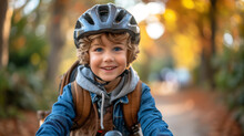 Young Boy Riding A Bicycle To School With A Backpack. Wearing Safety Helmet.